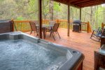 Hot tub under huge covered porch and open deck